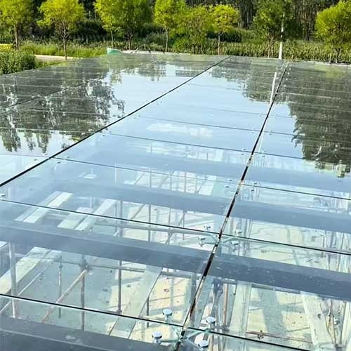 Glass Canopy Project for Underground Parking Entrance in Santiago, Chile | Application of Stainless Steel Spider Fittings and Routels