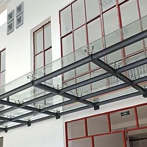 Mastering Tropical Architecture: A Guide to Glass Canopies Using Spider Fittings and Tension Rods in Malabo