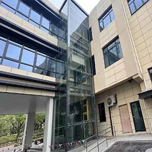Three-Story Glass Elevator Facade Project | Stainless Steel Spider Fittings & Routels